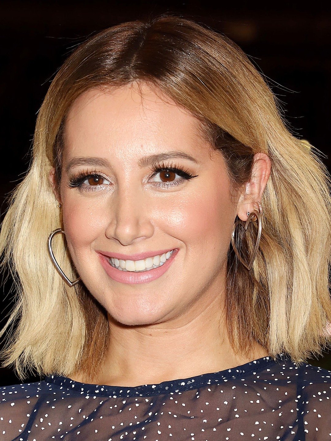 How tall is Ashley Tisdale?